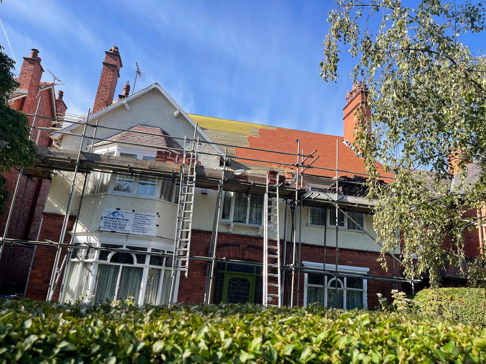 Re-roofing project in progress on a large detached property in Merseyside
